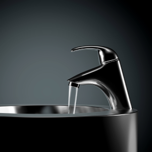 Basin mixer tap against dark background